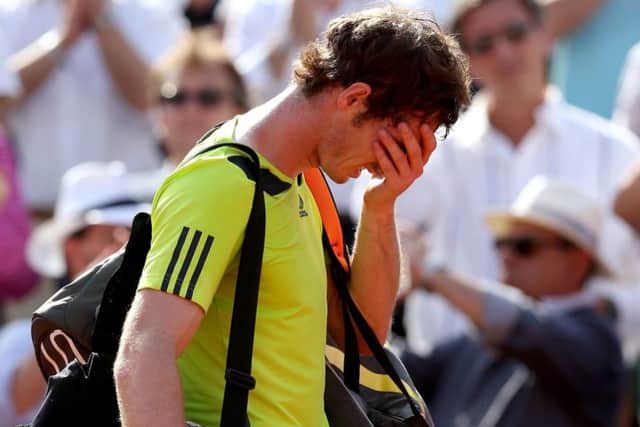 Andy Murray holds his head in his hands after being beaten in straight sets by Rafael Nadal in the French Open semi-final. Picture: Getty