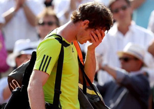 Andy Murray holds his head in his hands after being beaten in straight sets by Rafael Nadal in the French Open semi-final. Picture: Getty