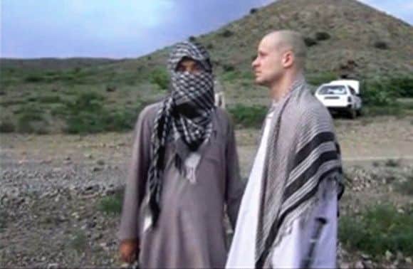 Sergeant Bowe Bergdahl, right, with a Taleban fighter before his release. Picture: AP