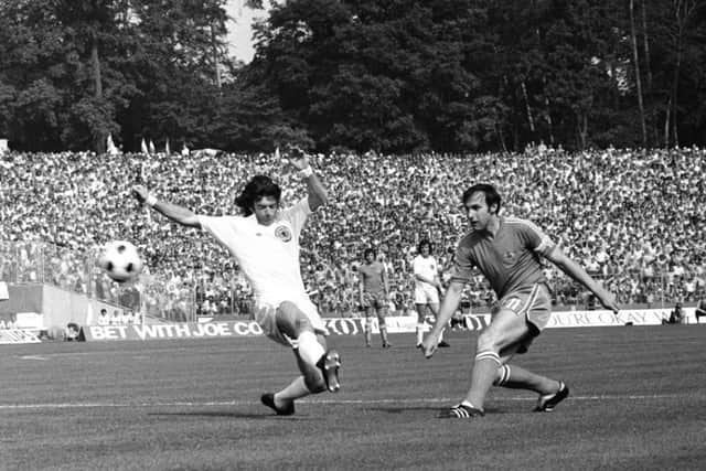 Willie Morgan, in an all-white Scotland kit, attempts to prevent Yugoslavia skipper Dragan Dzajic. Picture: Getty