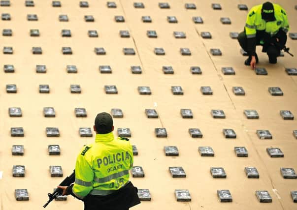 Colombian police with 440kg of seized cocaine at a police station in Medellin. Picture: Getty