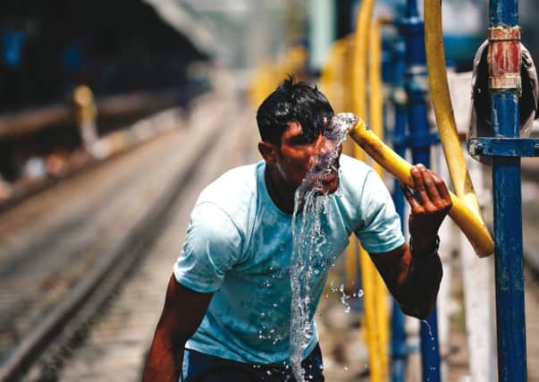 The sweltering temperatures test commuters at Allahabad railway station. Picture: AP