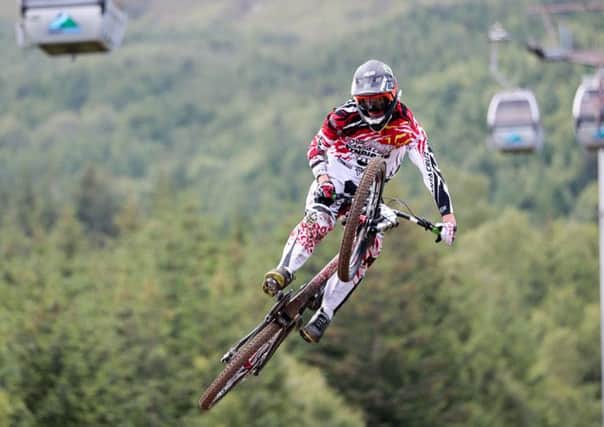 Airborne: competitors at the Mountain Bike World Cup scaled the heights in Fort William. Picture: Gary Williamson