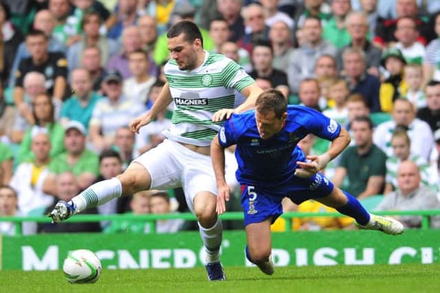 Tony Watt battles for the ball with Inverness CT's Gary Warren. Picture: Robert Perry
