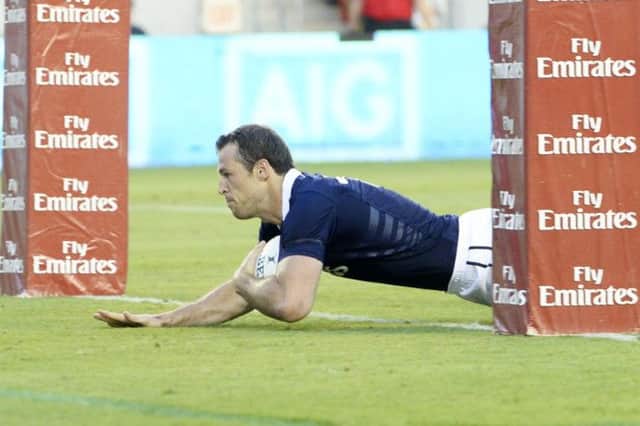 Tim Visser dives between the posts to touch down for the opening try of the match against USA in Houston. Picture: SNS