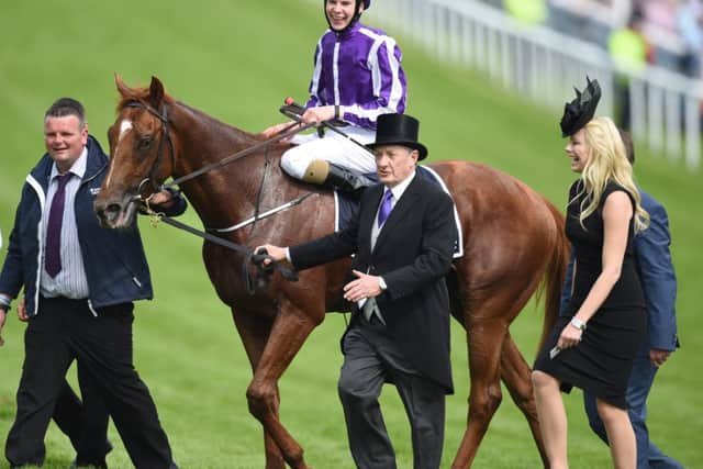 Joseph OBrien sits proudly aboard special horse Australia after their dominant victory in Saturdays Derby. Picture: PA