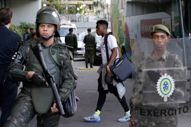 The Brazilian army were out in force yesterday to provide a high-security presence as England arrived. Picture: AP
