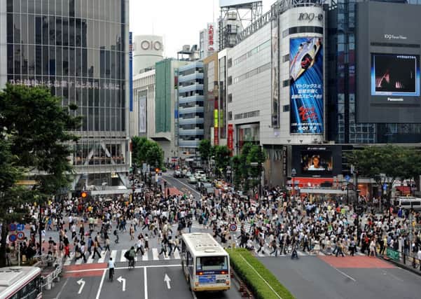 Shibuya crossing in the heart of Tokyo  Japan watchers await results of the countrys latest measures. Picture: Getty