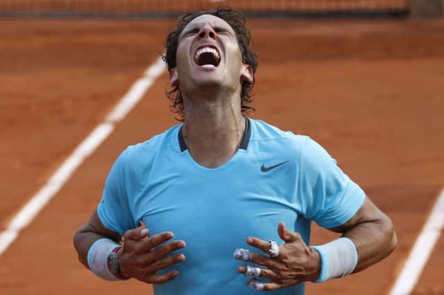 Rafael Nadal roars with delight after his latest French Open triumph yesterday. Picture: Getty