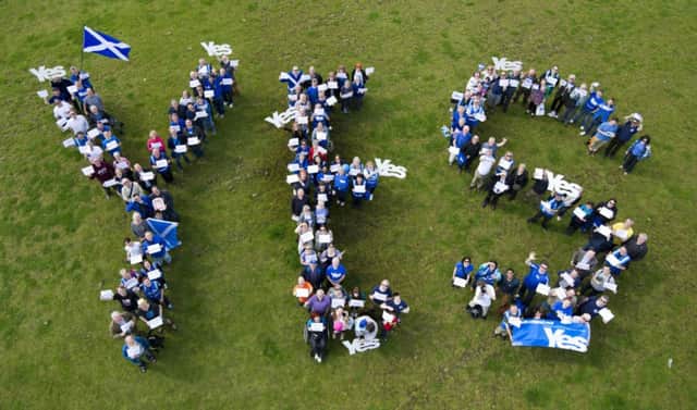 With just 100 days to go to the referendum, 100 Yes Scotland volunteers gathered in Edinburgh. Picture: PA
