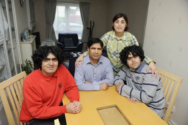 Asma and Riaz Haq and their autistic sons Rameez, 15, left, Faizan, 17. Picture: Greg Macvean