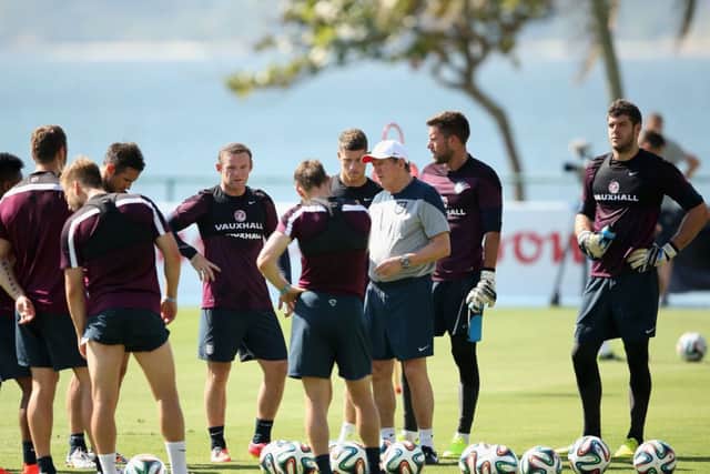 England manager Roy Hodgson gives his players a briefing during yesterdays training session in Rio. Picture: Getty