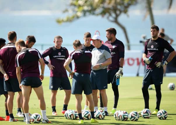England manager Roy Hodgson gives his players a briefing during yesterdays training session in Rio. Picture: Getty