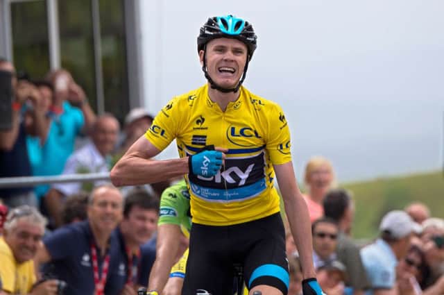 Chris Froome crosses the finishing line to win the second stage of the Criterium du Dauphine yesterday. Picture: Getty