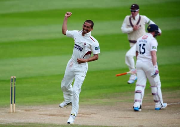 A thrilled Alfonso Thomas celebrates his fourth wicket as Matt Machan trudges off. Picture: Getty
