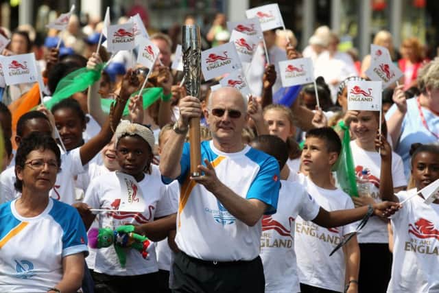 Batonbearer Trevor Low holding the Queen's Baton in Leicester, England before it arrives in Scotland on Saturday. Picture: Getty