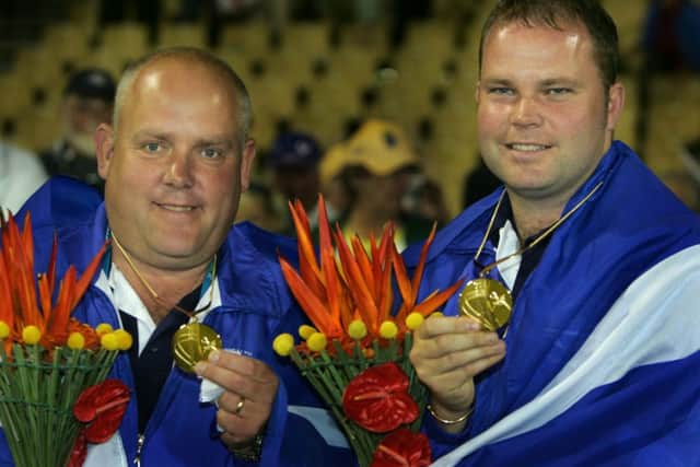 Alex Marshall, left, and Paul Foster with their gold medals from the mens pairs at Melbourne in 2006. Picture: AP