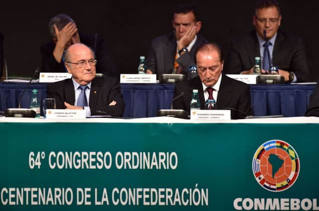 Fifa president Sepp Blatter, left, and Conmebol president Eugenio Figueredo attend the Conmebol Congress. Picture: AFP/Getty