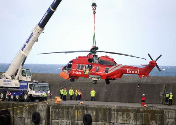A Super Puma which had ditched in the North Sea 25 miles off Aberdeen is brought back to dry land. Picture: Phil Wilkinson