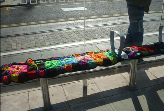 The tram stop bench covered in wool. Picture: Contributed