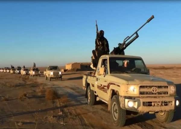 An image grab allegedly shows ISIL militants driving at an undisclosed location in Iraq's Nineveh province. Picture: Getty