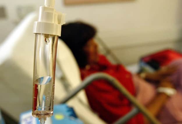 A patient receives a chemotherapy drip. Experts say the new treatment boosts the bodys own defences. Picture: Getty