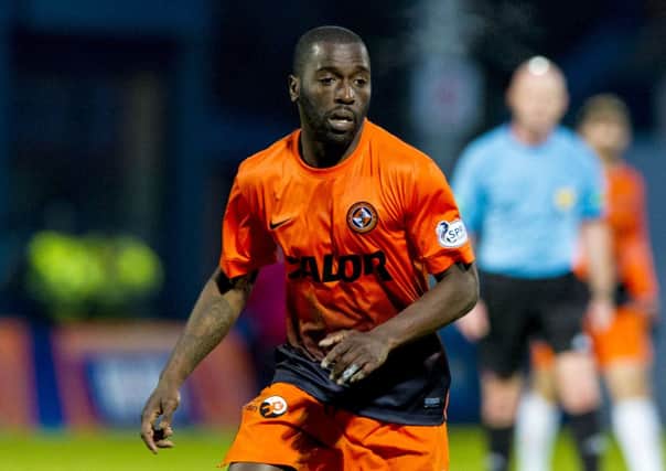 Morgaro Gomis in action for Dundee United against Ross County in January 2014. Picture: SNS