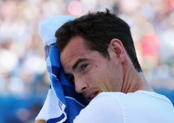 Andy Murray wipes his face during his straight-sets defeat to Radek Stepanek at the Aegon Championships. Picture: Getty