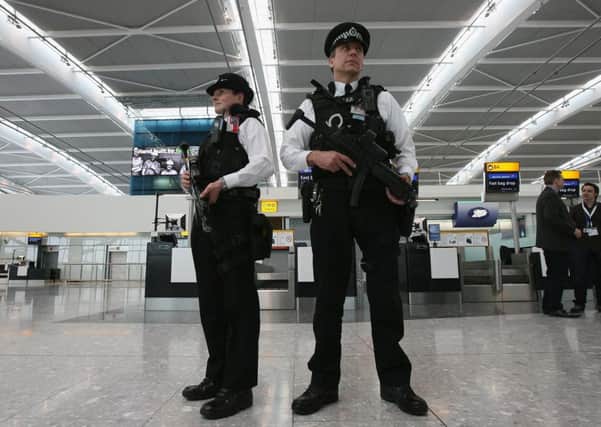 Armed police officers are a common sight at British airports - but Highland councillors have objected to their use being made widespread across the region by police. Picture: Getty