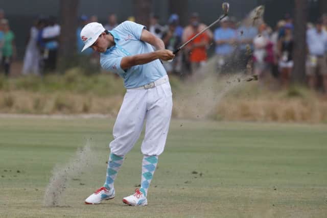 Rickie Fowler plays a shot at the 12th hole wearing plus fours as a tribute to his golfing hero Payne Stewart. Picture: Reuters