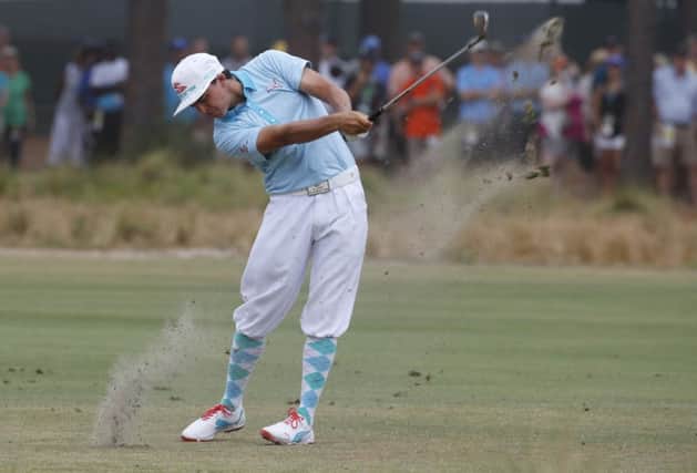 Rickie Fowler plays a shot at the 12th hole wearing plus fours as a tribute to his golfing hero Payne Stewart. Picture: Reuters