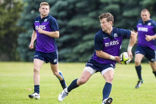 Peter Horne gets on the ball in training as he prepares to face Canada. Picture: SNS