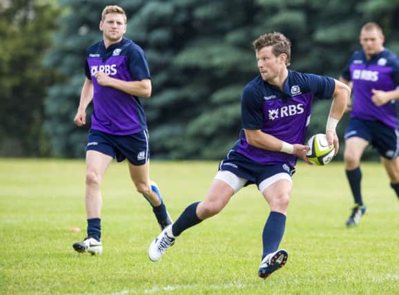 Peter Horne gets on the ball in training as he prepares to face Canada. Picture: SNS