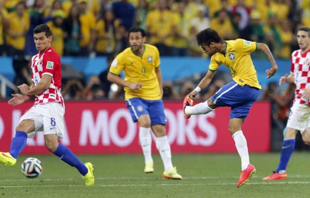 Neymar shoots home to equalise for Brazil in last nights opening match of the World Cup. Picture: AP