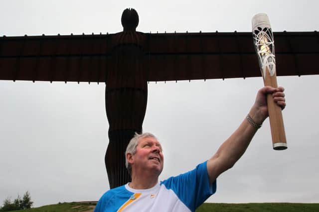 Batonbearer Brendan Foster holding the Queen's Baton at the Angel of the North, Newcastle as it heads towards Glasgow. Picture: PA Wire
