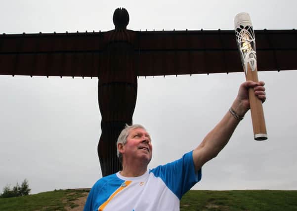 Batonbearer Brendan Foster holding the Queen's Baton at the Angel of the North, Newcastle as it heads towards Glasgow. Picture: PA Wire