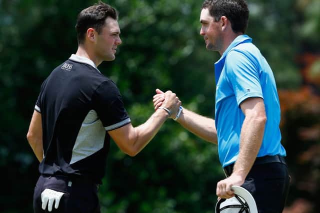 Martin Kaymer, left, shakes hands with Keegan Bradley. Picture: Getty