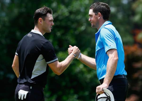 Martin Kaymer, left, shakes hands with Keegan Bradley. Picture: Getty