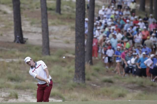 Justin Rose chips to the fifth green during the second round. Picture: AP