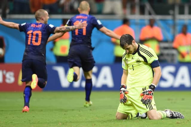 Spains goalkeeper Iker Casillas stares at the ground in despair. Picture: Getty