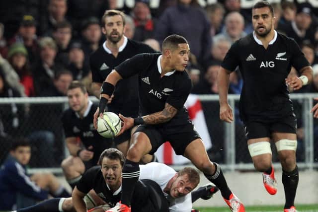 Aaron Smith has plenty of support as he launches another attack. Picture: Getty