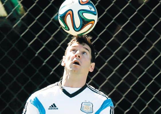 Argentinas Sergio Aguero talks to teammate Lucas Biglia during a training. Picture: AP