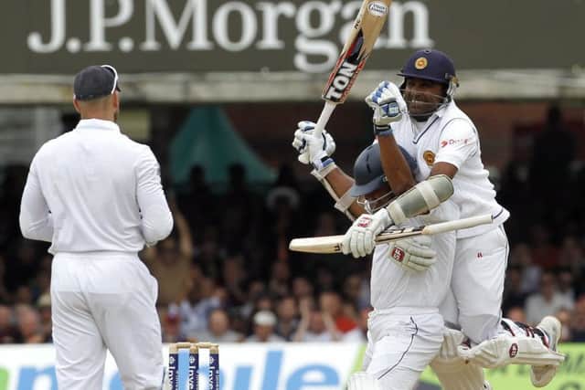 Kumar Sangakkara celebrates his century with Mahela Jayawardene. Picture: Getty