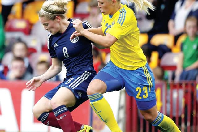 Scotlands Kim Little and Swedens Elin Rubensson battle for the ball at Fir Park.  Picture: PA