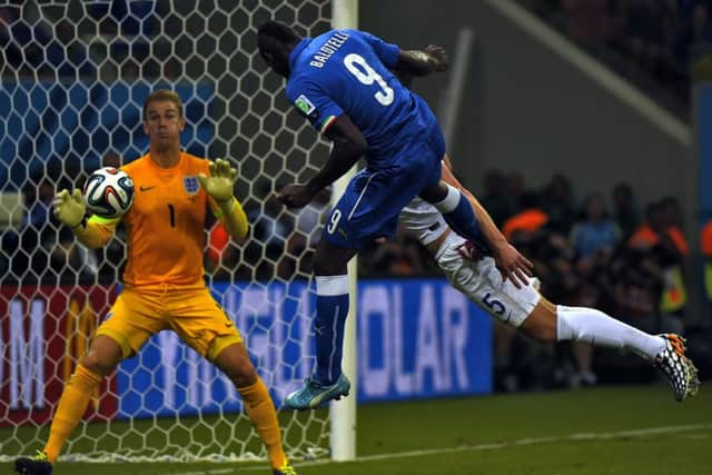 Mario Balotelli scores Italy's winning goal with a back post header. Picture: Getty