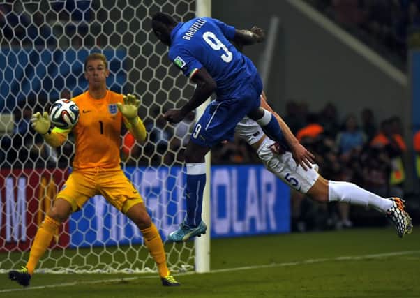 Mario Balotelli scores Italy's winning goal with a back post header. Picture: Getty