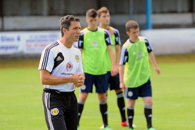 Under 19 coach John Collins leads a training session, the former Hibs manager is expected to be unveiled by Celtic this week. Picture: TSPL