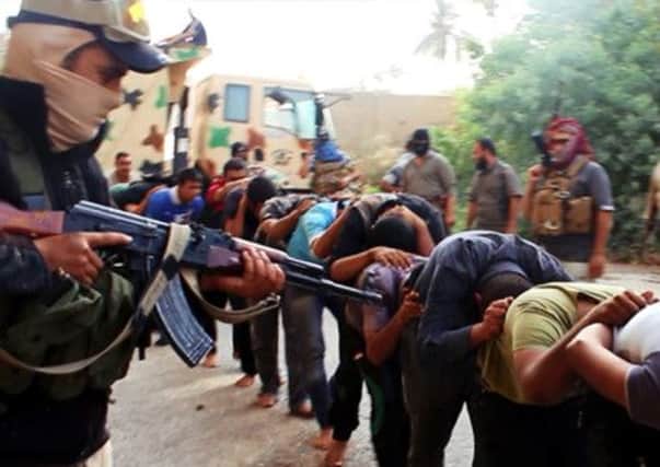 This image appears to show Isis militants leading away captured Iraqi soldiers. Picture: AP