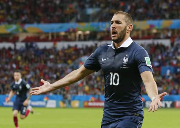 France's Karim Benzema celebrates after scoring his side's third goal. Picture: AP