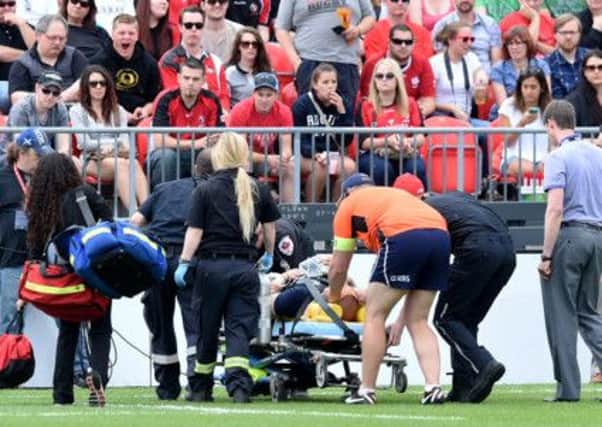 Scotland flanker Alasdair Strokosch leaves the filed on a stretcher. Picture: SNS